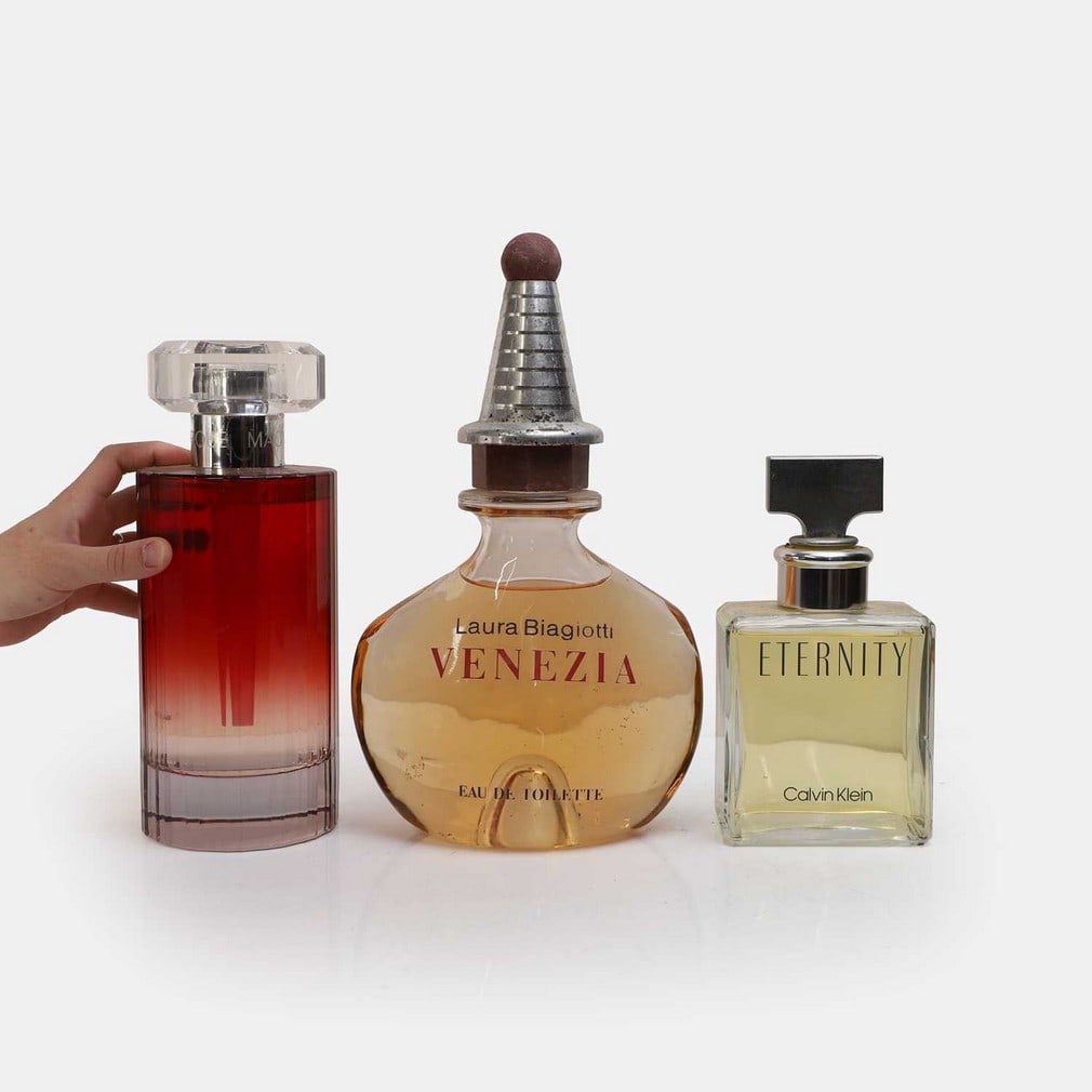 Three oversized glass perfume and eau de toilette advertising bottles, circa 1990-2008, (1 of 3)
