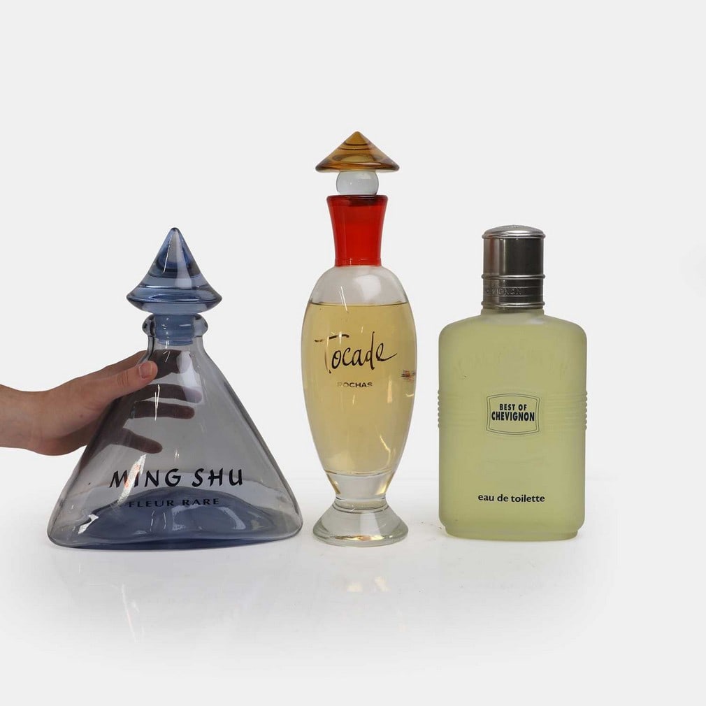 Three oversized glass perfume and eau de toilette advertising bottles, circa 1994-1997, (1 of 3)