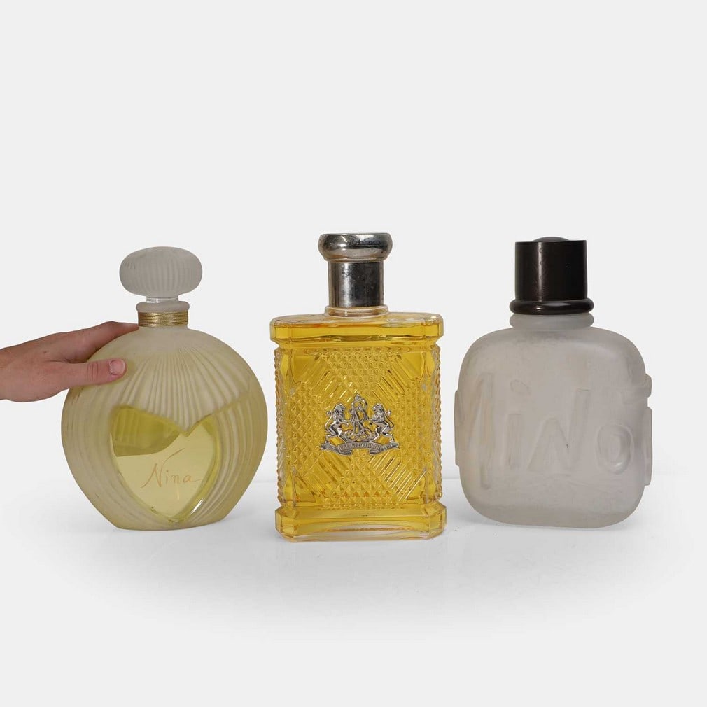 Three oversized glass perfume and aftershave advertising bottles, circa 1992, (1 of 3)