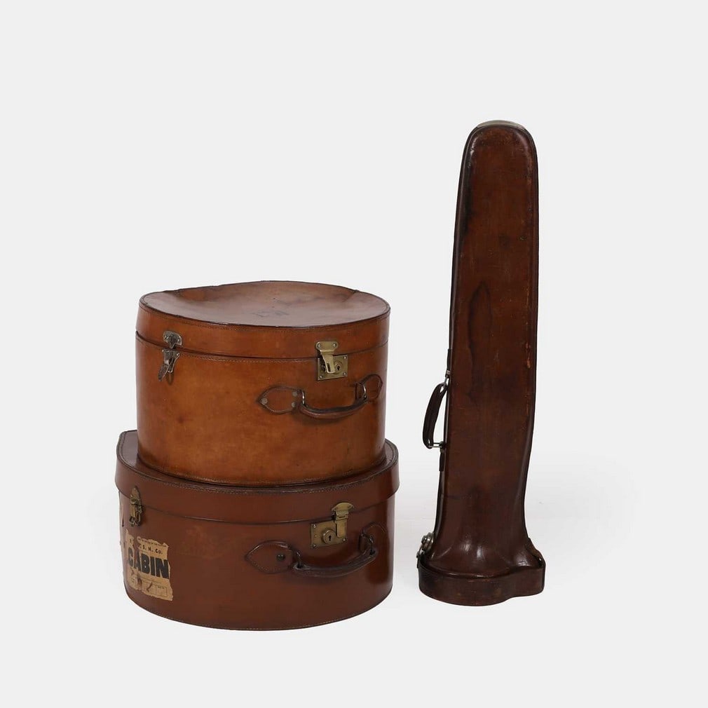 Two hat boxes and a trombone case, 20th century, (1 of 3)