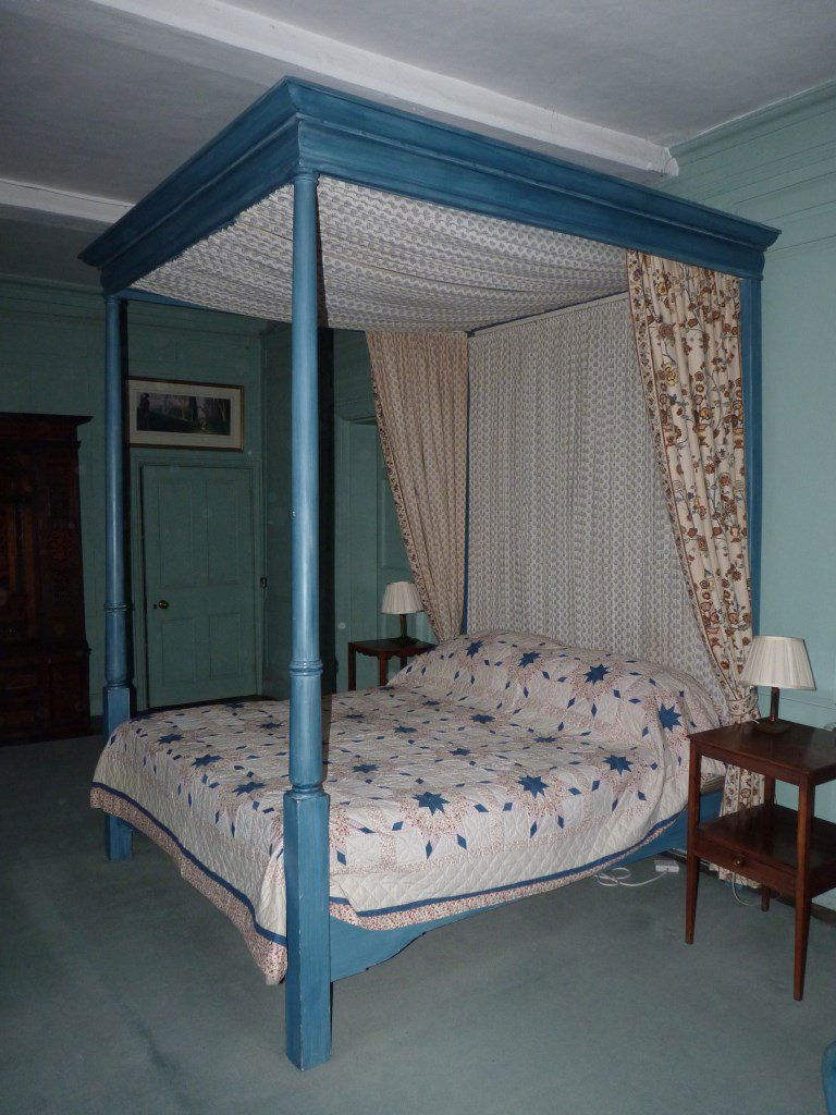 A four-poster bed, by Peter Harbern of Bath, painted: A four-poster bed, by Peter Harbern of Bath, painted blue with floral drapes, 261cm high 186cm wide