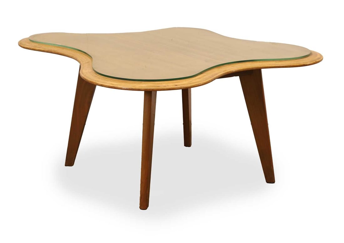 Neil Morris for H Morris & Co. - 'Cloud' table, designed 1947,: Neil Morris for H Morris & Co. - 'Cloud' table, designed 1947, the shaped teak laminate top raised on oblong section tapered supports 113cm wide, 48.5cm high