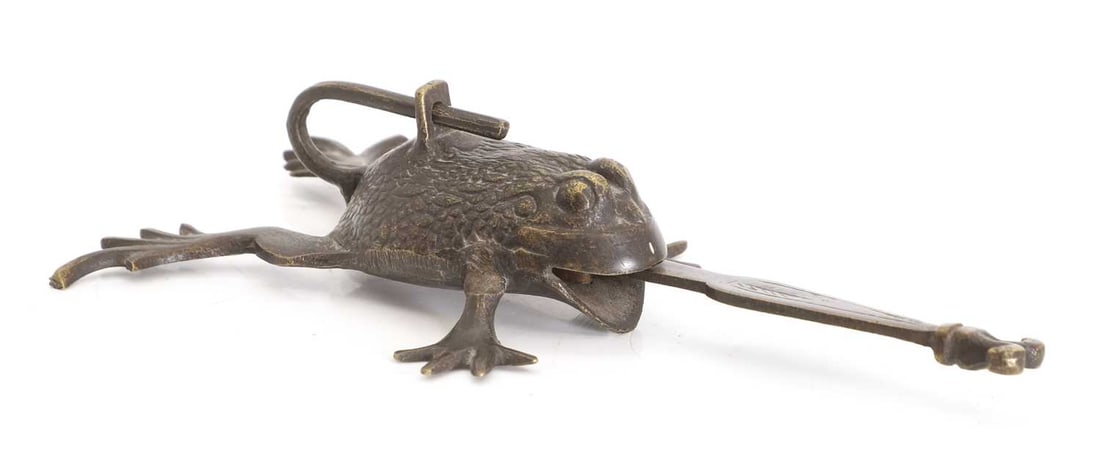An Afghan bronze lock,: An Afghan bronze lock, in the shape of a frog, with pin locking mechanism 10.5cm wide, 20cm long