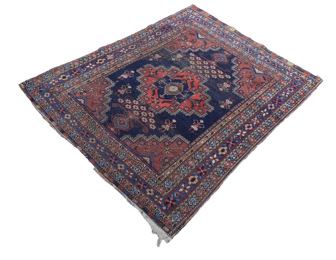 A Persian rug, (1 of 2)