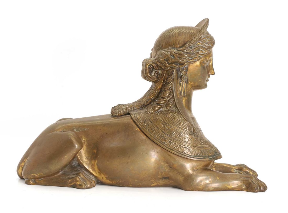 A brass Egyptian Revival sphinx, late 19th century, - 2