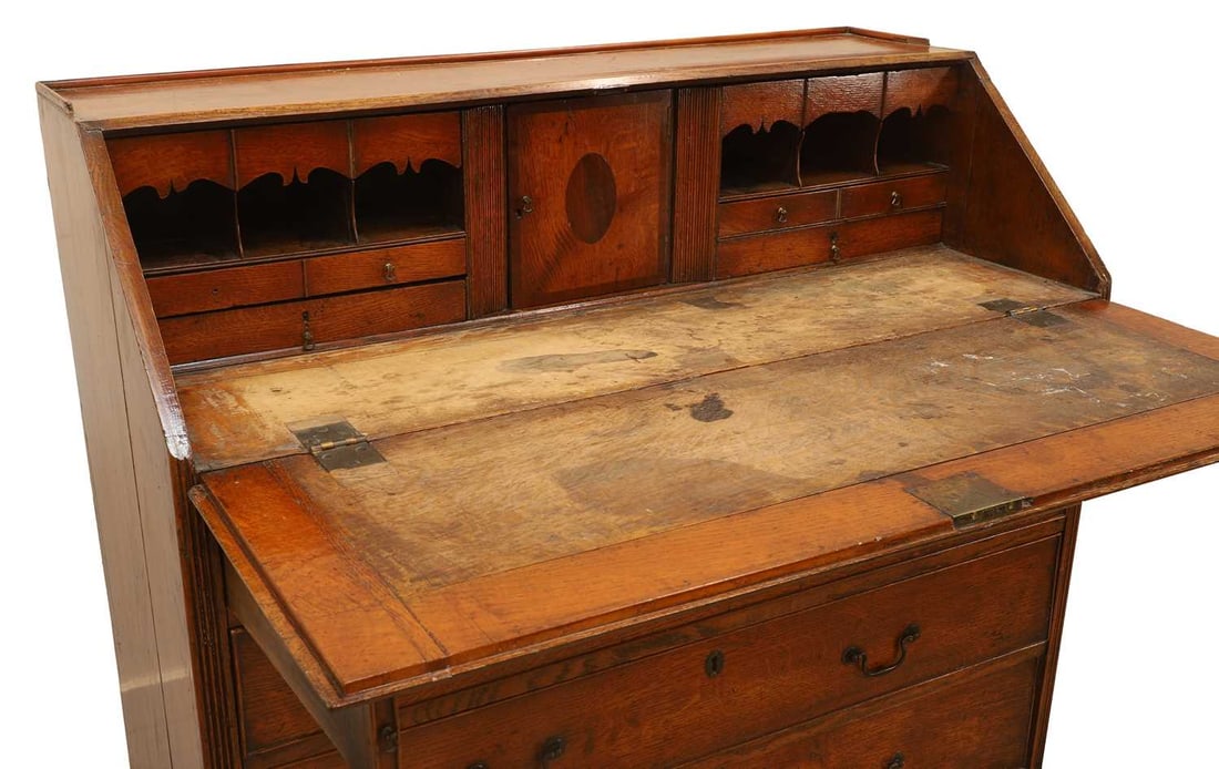 A George III oak bureau, early 19th century, - 2