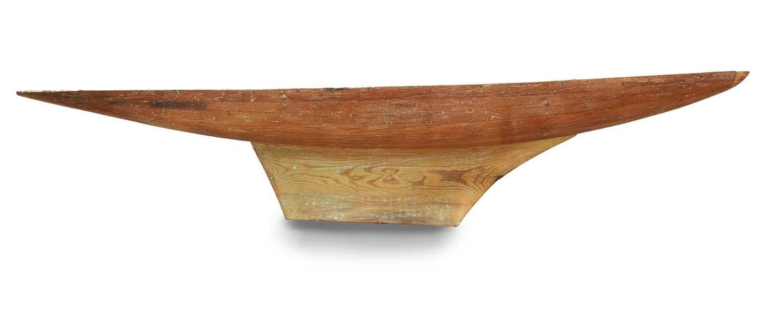 A large Victorian pond yacht hull, Circa 1900,: A large Victorian pond yacht hull, Circa 1900, the carvel built hull, tacked with copper studs, with a modified short keel, the interior still with paint, supported with cross suports, centre sections