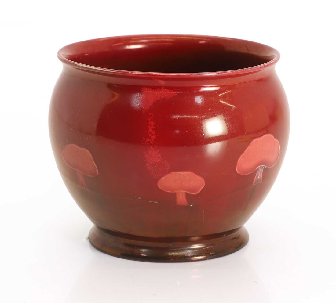 A Moorcroft Claremont vase,: A Moorcroft Claremont vase, red flambe glaze, with incised mark to the base 11cm wide, 9.2cm high Condition Report: Historic chip to the base. Some fritting to the rim. Scratches and marks to the