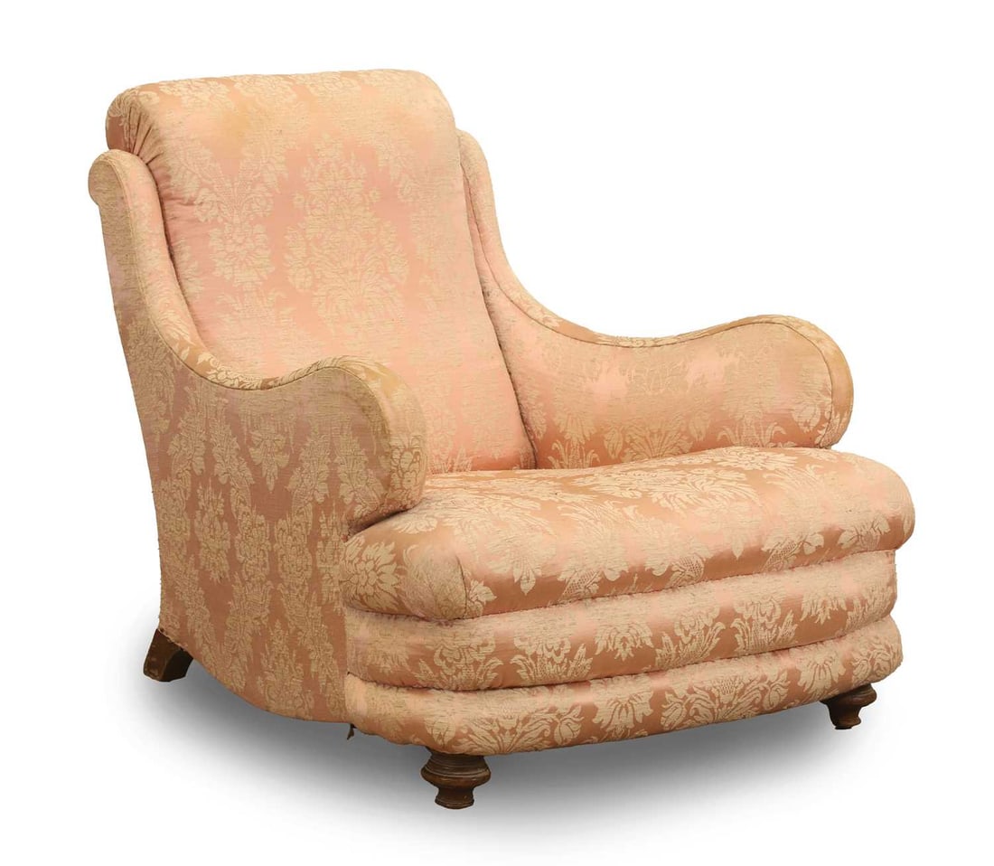 A Victorian walnut armchair, 19th century: A Victorian walnut armchair, 19th century in the Howard & Sons style, covered in a pink damask fabric, on turned feet 75cm wide, 96cm deep, 78cm high Condition Report: Staining and dirt present,