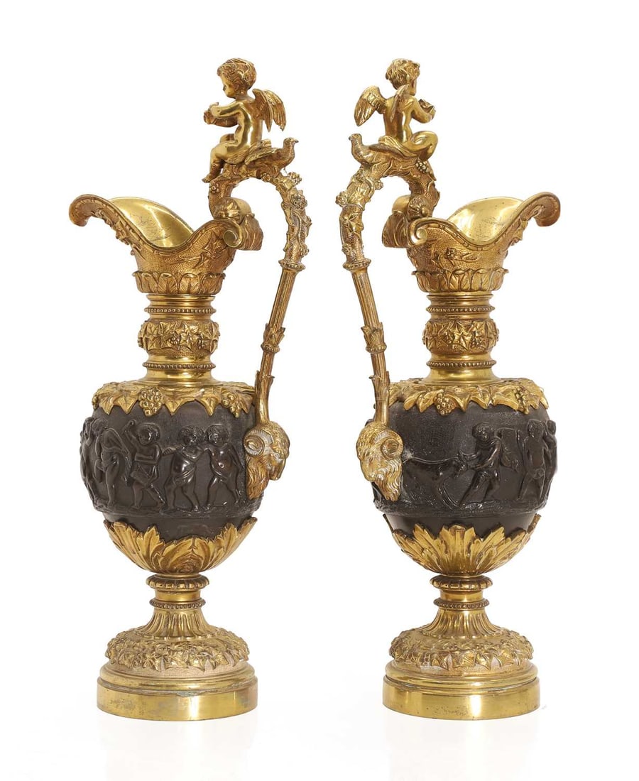 A pair of gilt metal ewers, 19th century, - 2