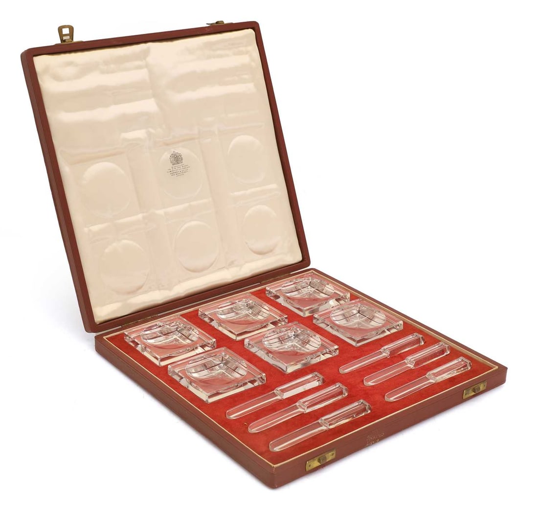 A set of six Baccarat butter pats,: A set of six Baccarat butter pats, together with six glass knives, in original Baccarat case, marked Dishes, 6.3cm wide, Knives, 10.2cm long 12 Condition Report: Some minor chipping to the knives