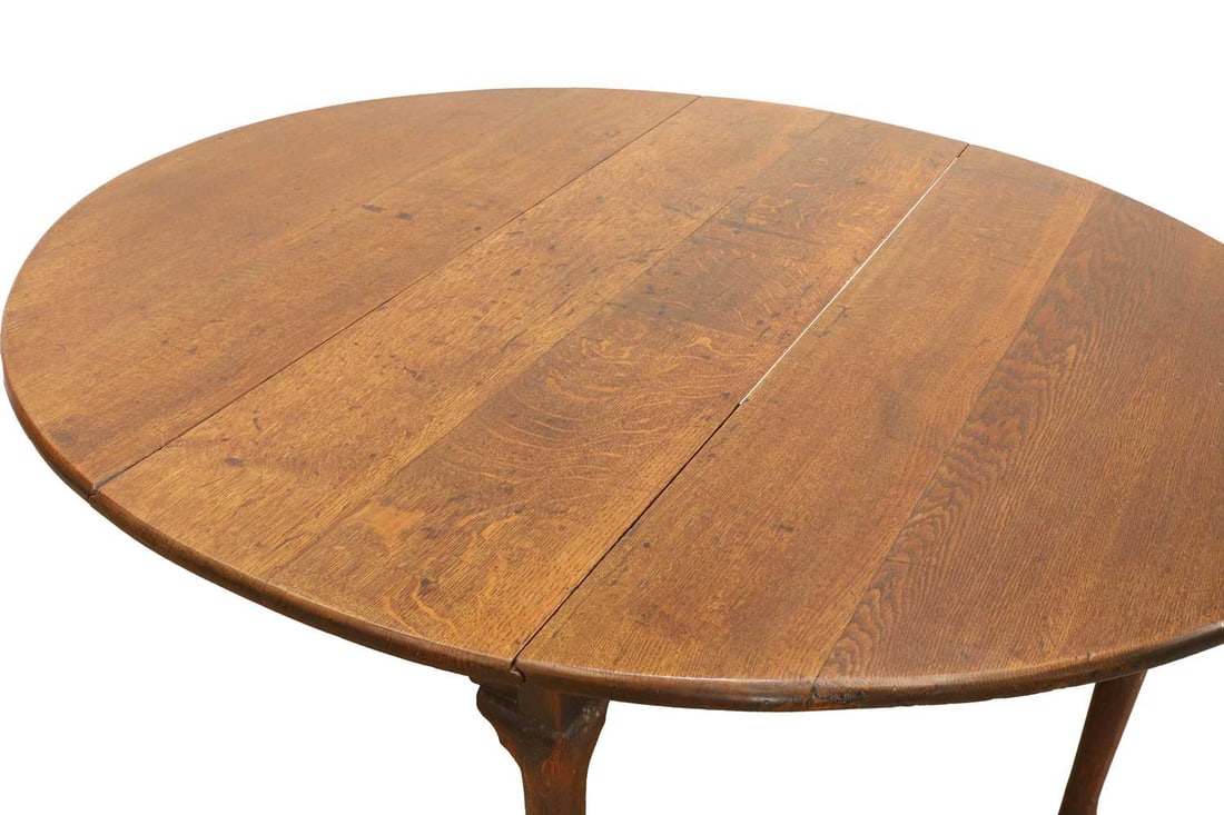 A George II oak drop flap table, mid 18th century, - 2