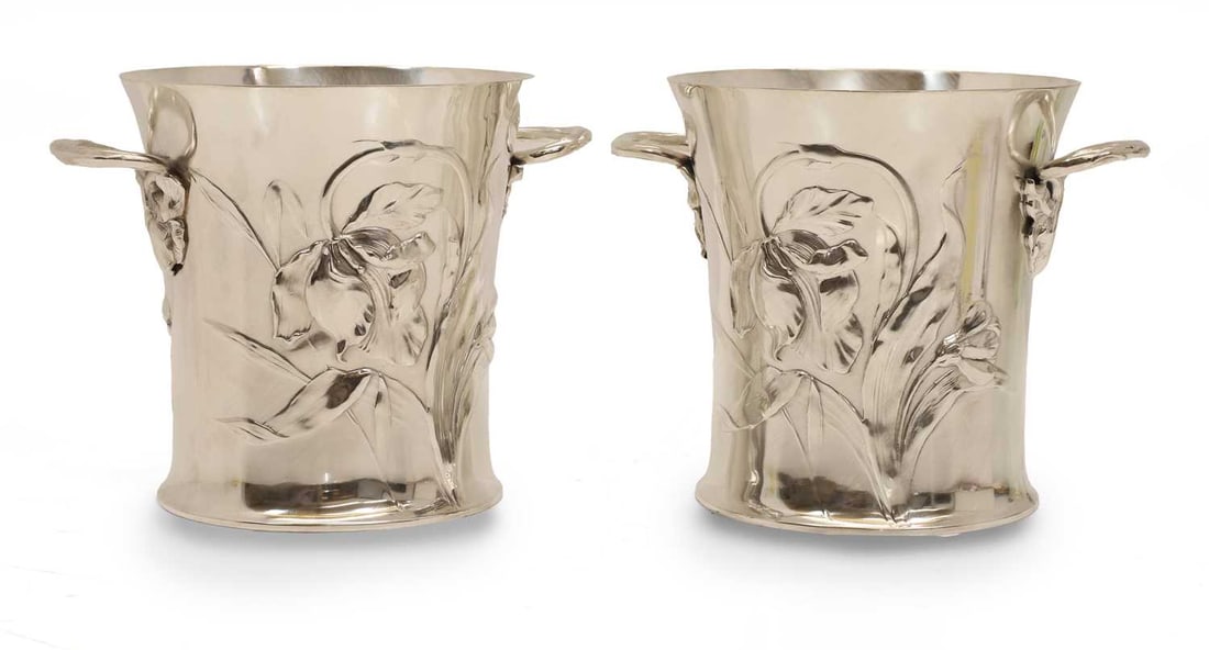 A pair of silverplated Art Nouveau ice buckets, 20th century,: A pair of silverplated Art Nouveau ice buckets, 20th century, embossed with daffodils and with twin handles terminating in a daffodil motif 26cm wide 19cm deep, 20cm high 2