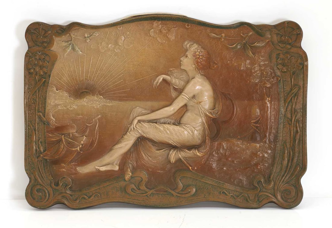 Ernst Wahliss (Austrian, 1837-1900) an Austrian pottery plaque, circa 1900,: Ernst Wahliss (Austrian, 1837-1900) an Austrian pottery plaque, circa 1900, modelled as a seated lady watching the sunrise, impressed mark to the back and numbered 'D.195' 56cm wide, 39cm high