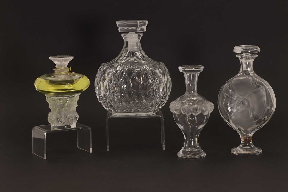 A group of four Lalique perfume bottles, of recent manufacture, French, (1 of 2)