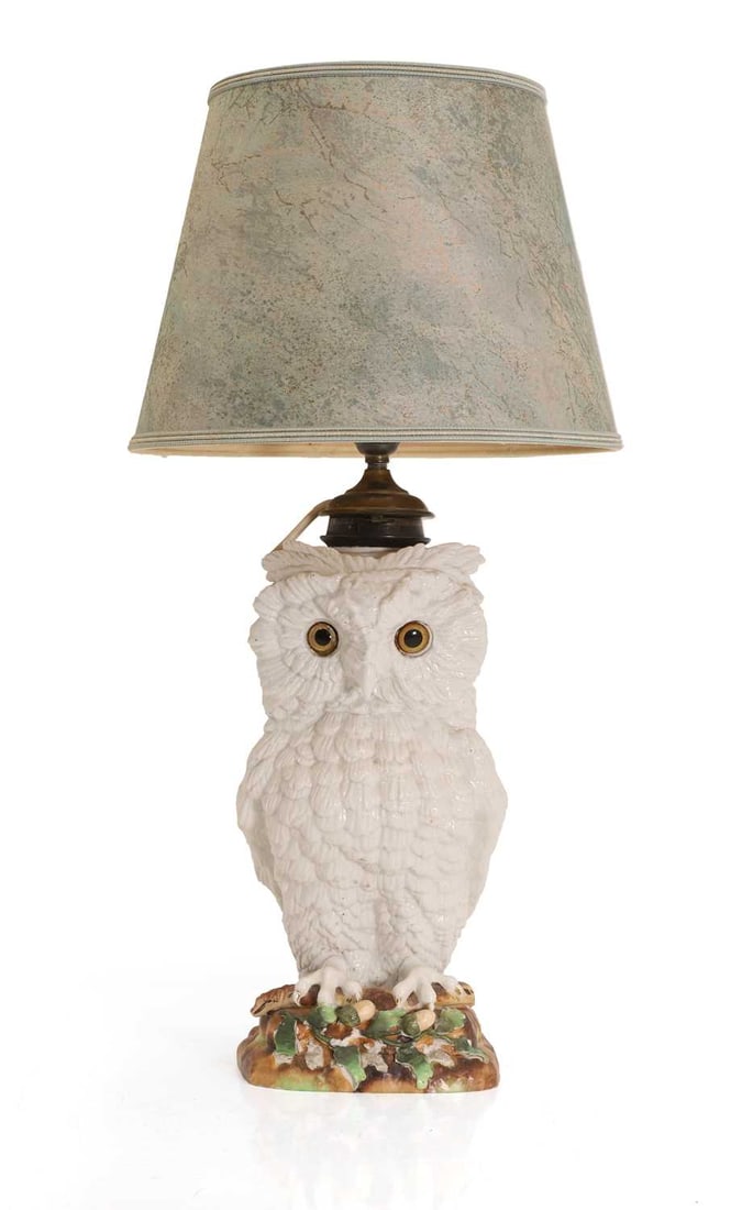 A Victorian porcelain owl oil lamp, 19th century and later,: A Victorian porcelain owl oil lamp, 19th century and later, converted, with glass eyes, with a painted plinth, moulded with acorn and oak leaves, the collar stamped 'Messenger's Patent' 16cm wide, 18c