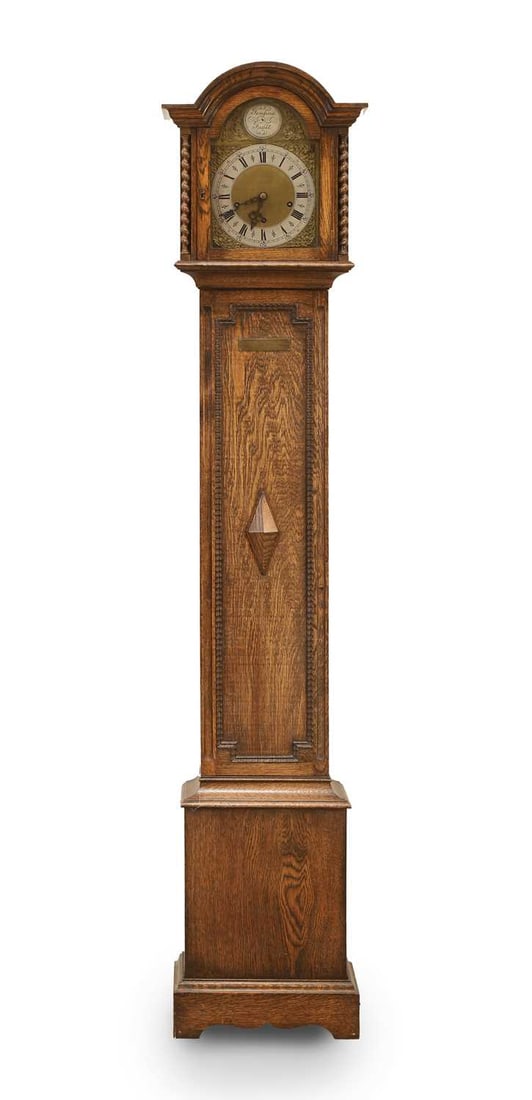 A Westminster chiming grandmother clock, early 20th century,: A Westminster chiming grandmother clock, early 20th century, with a silvered dial, with a presentation inscription to the trunk 18cm diameter dial, 171cm high Condition Report: With a key. Fair overal