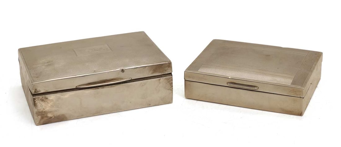 A pair of silver cigarette cases,: A pair of silver cigarette cases, of a different size and detail, one by J S & Co, Birmingham, 1953, the other, Mappin and Webb, Birmingham, 1958