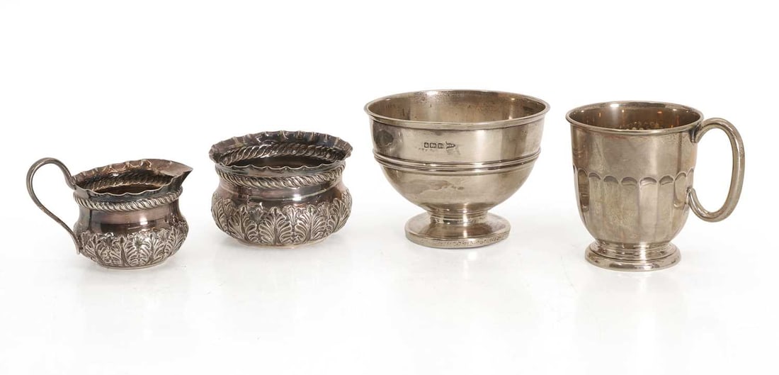 A silver christening mug, a silver bowl Sheffield, 1933 and 1904,: A silver christening mug, a silver bowl Sheffield, 1933 and 1904, and two further Victorian embossed silver cream jug and sugar bowl largest, 10.5cm diameter, 12.2ozt 4 Condition Report: ALl used and 