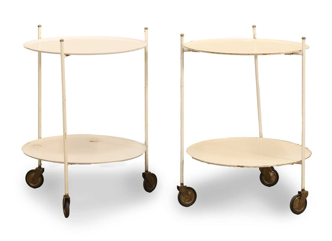 A pair of painted metal butler's tray occasional tables, second half of the 20th century,: A pair of painted metal butler's tray occasional tables, second half of the 20th century, the two-tier frame terminating in oversized castors, labelled 'BIEFFECI' to the base of one tray 49cm wide,
