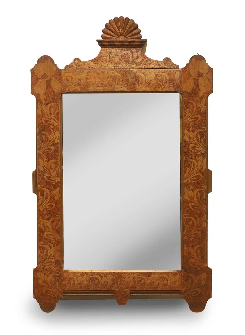 A stained maple mirror, 19th century,: A stained maple mirror, 19th century, in the Dutch or Flemish taste, the rectangular mirror plate enclosed within a shaped frame decorated with foliate detail throughout, surmounted by a fan finial 85
