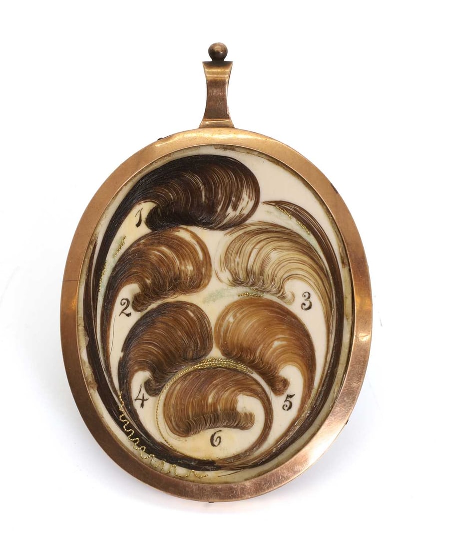 A portrait miniature pendant of a young woman, 19th century, - 2