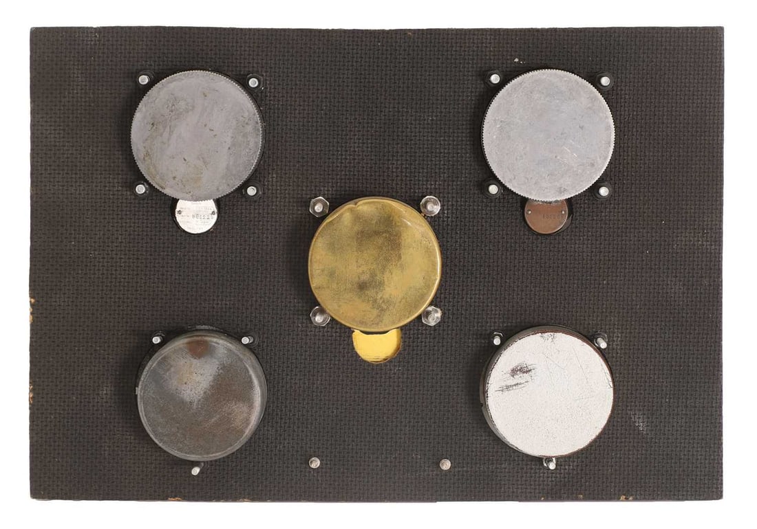 A board containing five examples of aircraft instrument clocks,'Borduhren Luftwaffe Weltkrieg II' 19 - 2