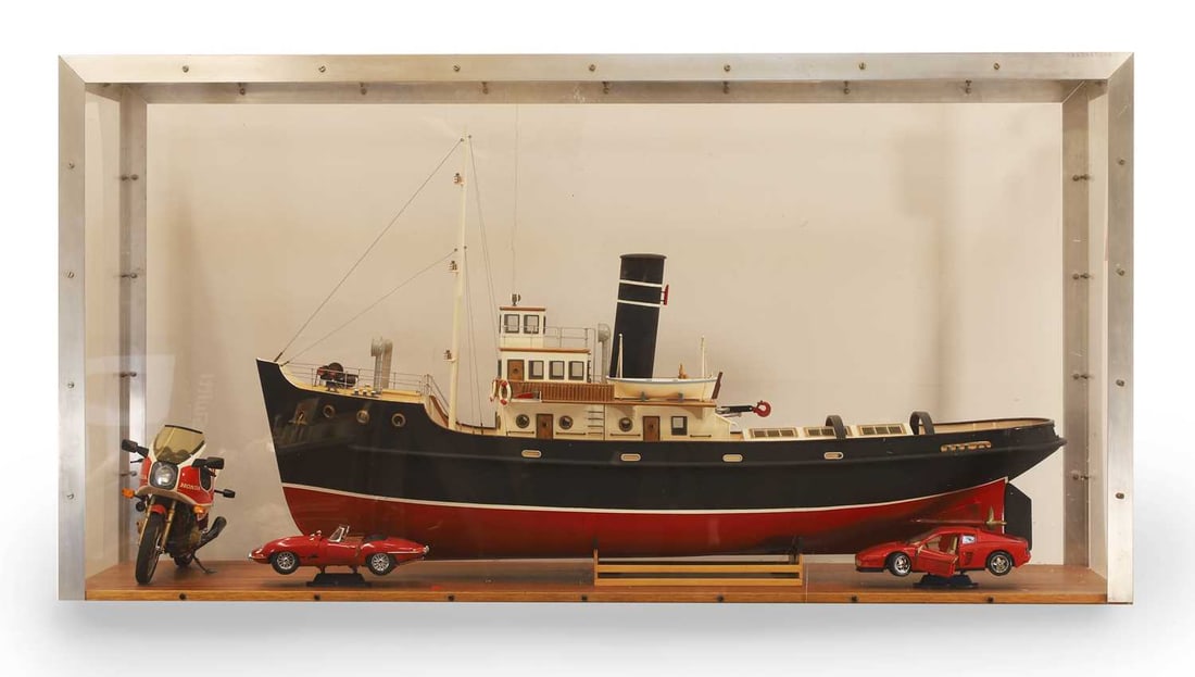 A cased model tug boat,: A cased model tug boat, 'MUIMOTA', on wooden base, cased with a model of a Honda motorcycle, a Ferrari and a Jaguar, all cased in perspex and metal case 46cm wide, 152cm long, 79cm high