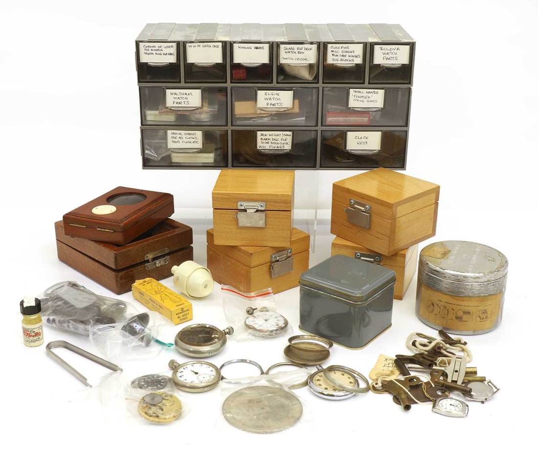 A collection of watch spares, key, and boxes 20th century: A collection of watch spares, key, and boxes 20th century fitted in plastic drawers, and others loose and in boxes Provenance: The John Mitchell Collection of Military Horology