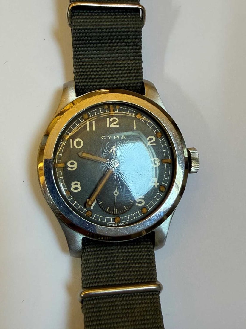 A Cyma stainless steel British military-issued ‘Dirty Dozen’ mechanical wristwatch, 1940 - 4