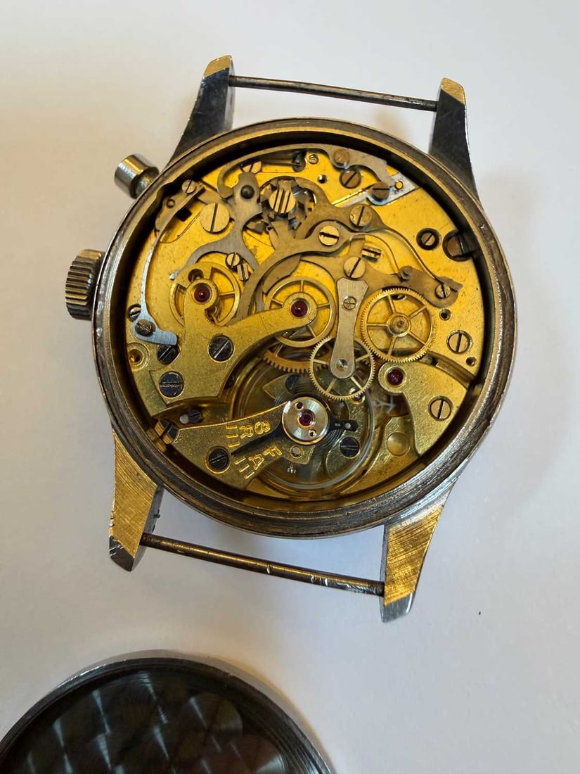 A Royal Navy issue single button chronograph stainless steel wristwatch, probably Lemania, - 12