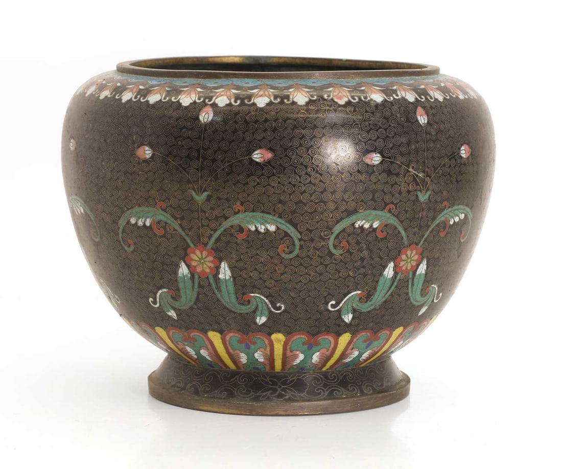 A Chinese cloisonné jardinière, Late 19th century,: A Chinese cloisonné jardinière, Late 19th century, with floral design, repeated motif around the rim, with a blue lining width 24.3cm height 19.6cm Condition Report: Some nibbles to the