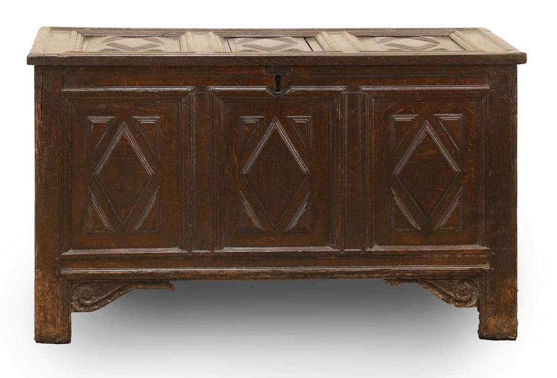 An oak coffer, 18th century,: An oak coffer, 18th century, with carved three panelled top and front, with a diamond cut motif, and shaped legs 100cm wide, 47cm deep, 60cm high Condition Report: Some play in the joints. Historic