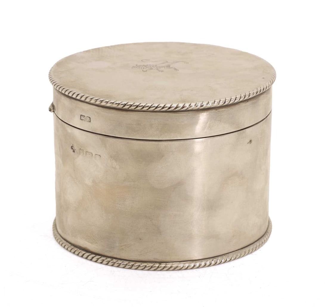 A silver hinged cover pot, probably Birmingham 1925,: A silver hinged cover pot, probably Birmingham 1925, the lid decorated with an engraved lion to the centre, enclosed within a notched border, marks rubbed 12.5cm diameter, 9.5cm high, 14.8ozt