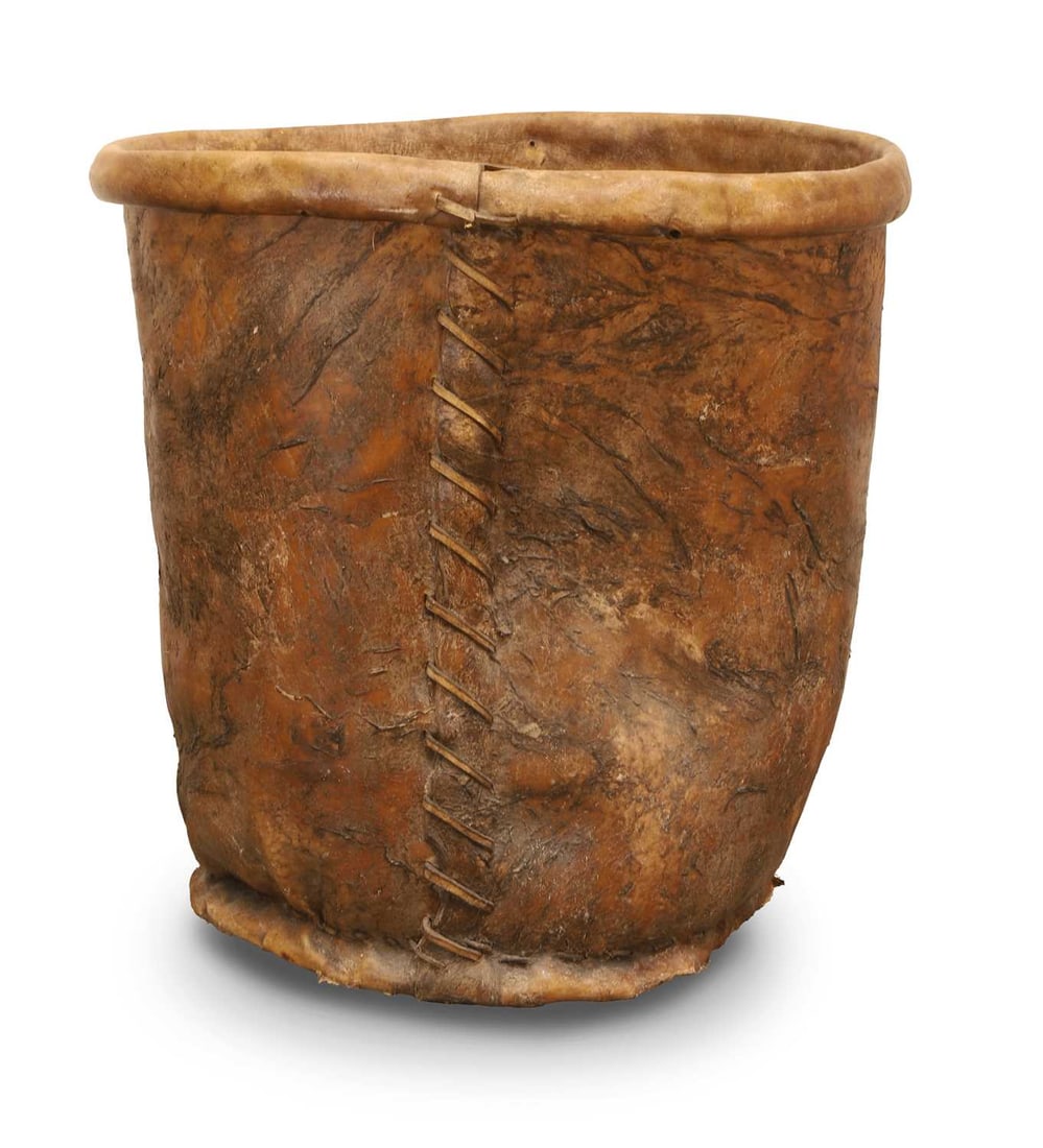 A large vellum bucket, 19th century,: A large vellum bucket, 19th century, the tapering cylindrical body with lipped top 54cm wide, 60cm high
