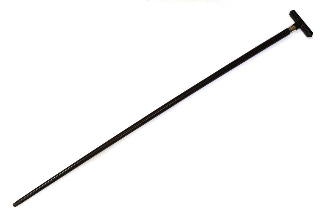 A silver and black onyx facet-cut walking cane, makers mark D&W, Birmingham, 1906,: A silver and black onyx facet-cut walking cane, makers mark D&W, Birmingham, 1906, the T-shaped handle, with a silver collar, on an ebony shaft, with a horn ferrule