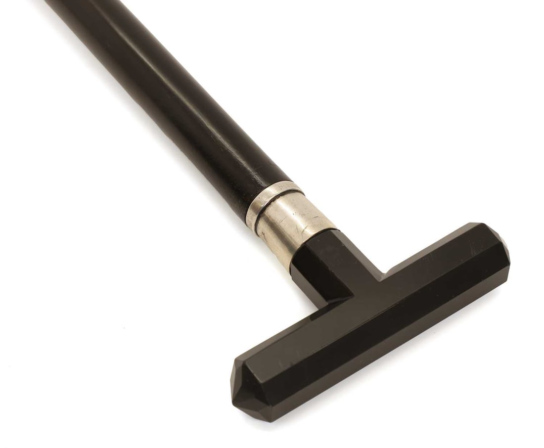 A silver and black onyx facet-cut walking cane, makers mark D&W, Birmingham, 1906, - 2