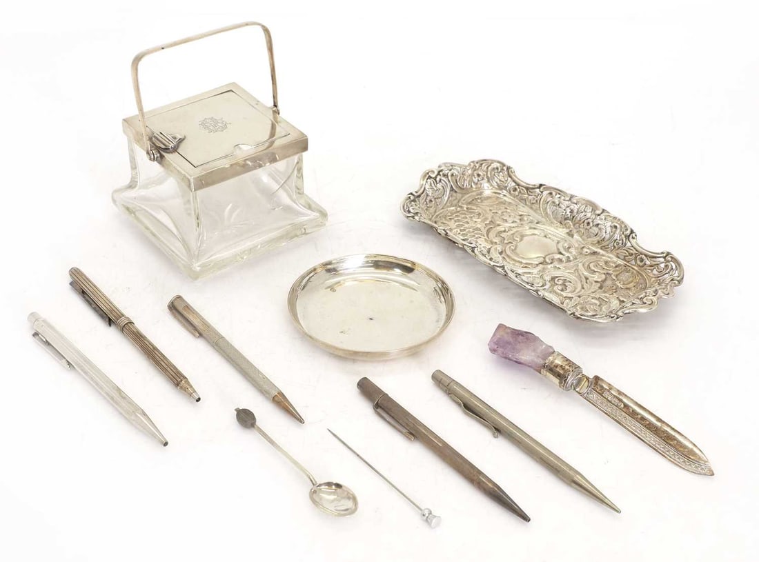 A silver pen tray,: A silver pen tray, by Henry Matthews, Birmingham, 1875, of rectangular form with pierced border, together with a silver and glass inkwell, London, 1905, together with a silver circular dish and a