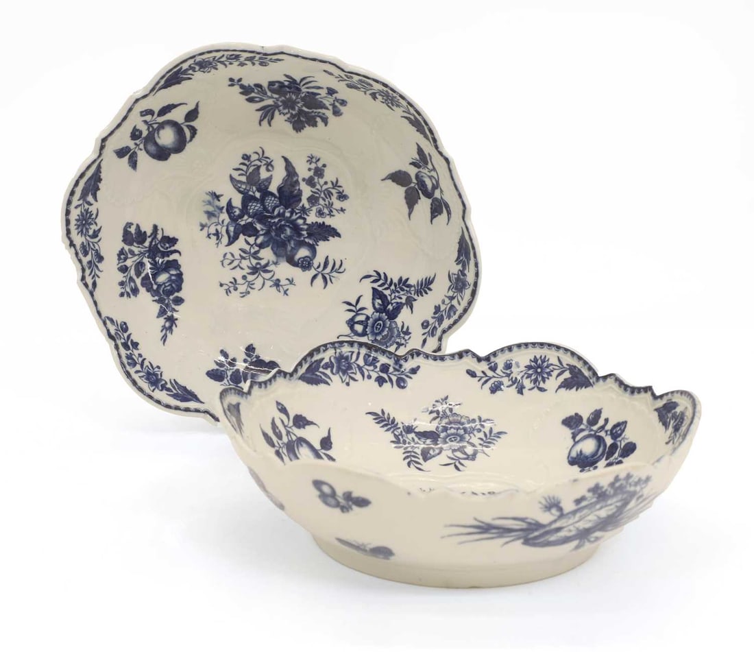 A pair of Caughley porcelain salad bowl, circa 1785: A pair of Caughley porcelain salad bowl, circa 1785 decorated in the 'Pinecone' pattern, each with a scalloped rim, 'C' mark 25.5cm diameter, 7.3cm high 2 Condition Report: One with a small chip to