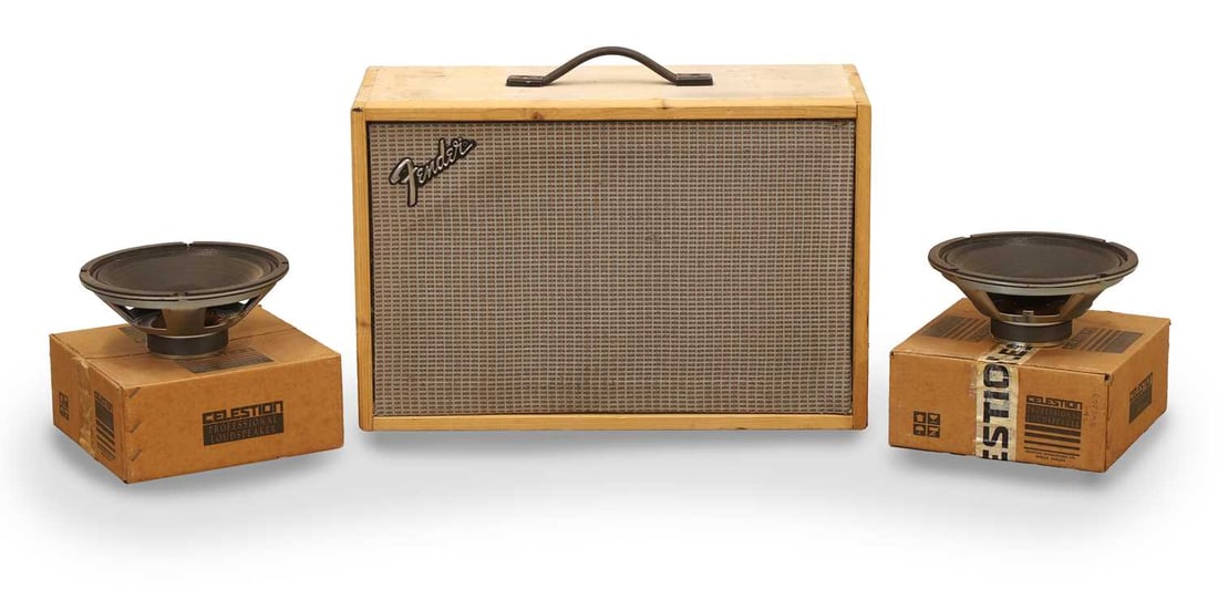 A homemade 2 x 10 guitar speaker cabinet: A homemade 2 x 10 guitar speaker cabinet the unfinished case with Fender style silver grille cloth and Fender badge, containing 2 x Jensen C10Q speakers, together with 2 x Celestion G10 L-35 16 Ohm