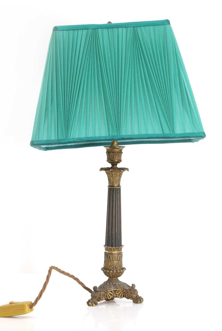 A French Empire ormolu column lamp, 19th century,: A French Empire ormolu column lamp, 19th century, with acanthus leaves and finial in a fine green silk shade and with a bronze-coloured flex, labelled 'Besselink & London' to the base with shade