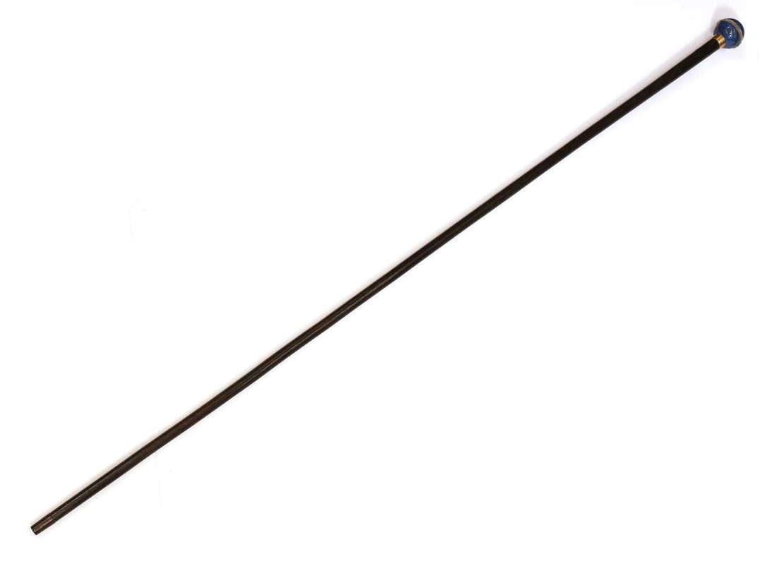 A Lapis Lazuli and rock crystal mounted walking cane, circa 1900,: A Lapis Lazuli and rock crystal mounted walking cane, circa 1900, with a banded gold collar, stamped Briggs, with an ebony shaft and a metal ferrule 97.5cm long