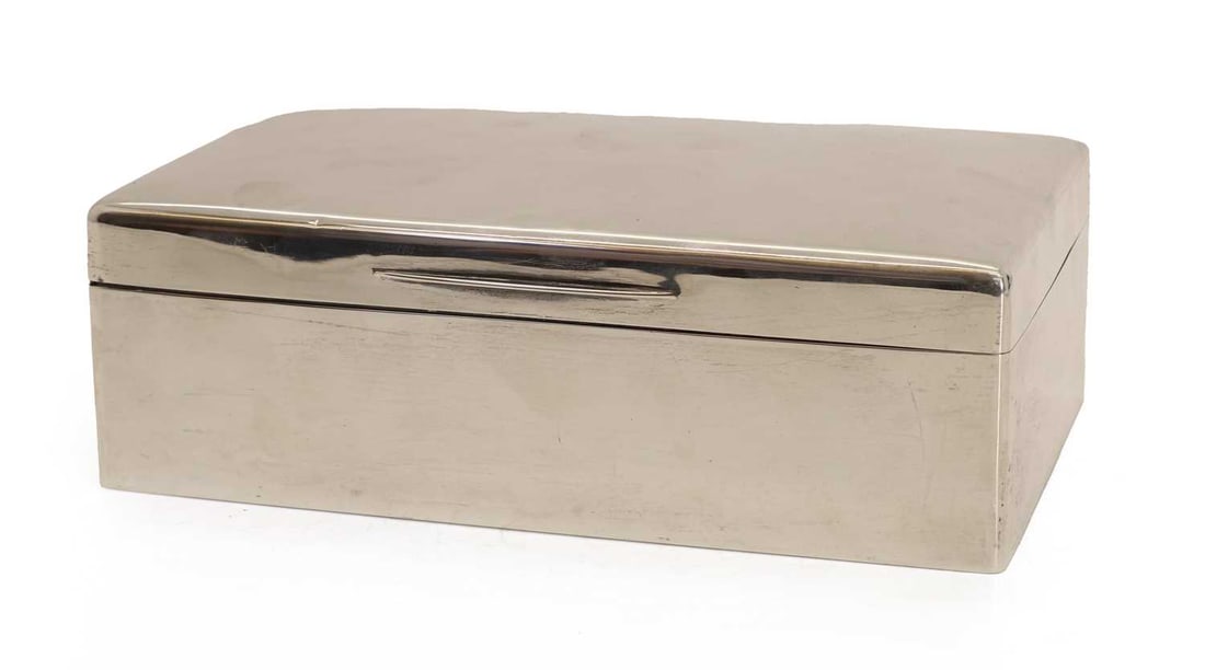 A silver cigar box,: A silver cigar box, by JB, London, 1920, the interior lined with wood 23cm wide, 14cm deep, 7.5cm high, total 37.7ozt