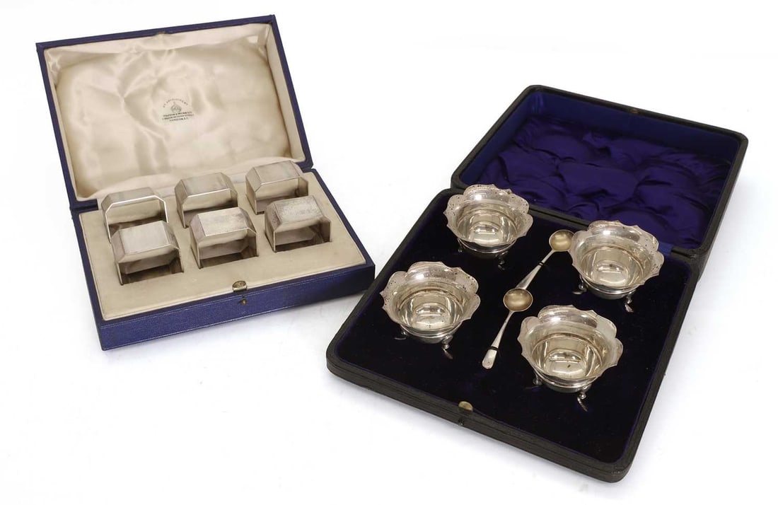 A collection of cased silver,: A collection of cased silver, to include a set of six canted square napkin rings by John Rose, Birmingham, 1937, with engine turned design, cased, a set of four salts by William Hutton & Sons Ltd,