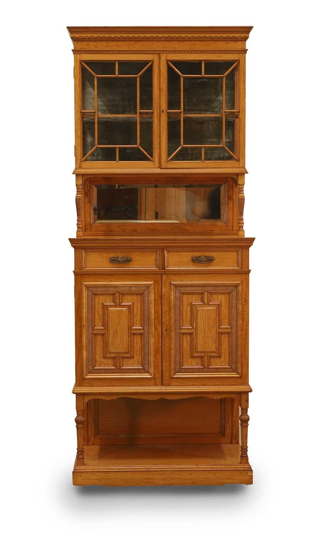 A late Victorian satinwood cabinet, early 20th century,: A late Victorian satinwood cabinet, early 20th century, with pair of glazed panel doors above two frieze drawers and cupboards below 70cm wide, 37cm deep, 175cm high