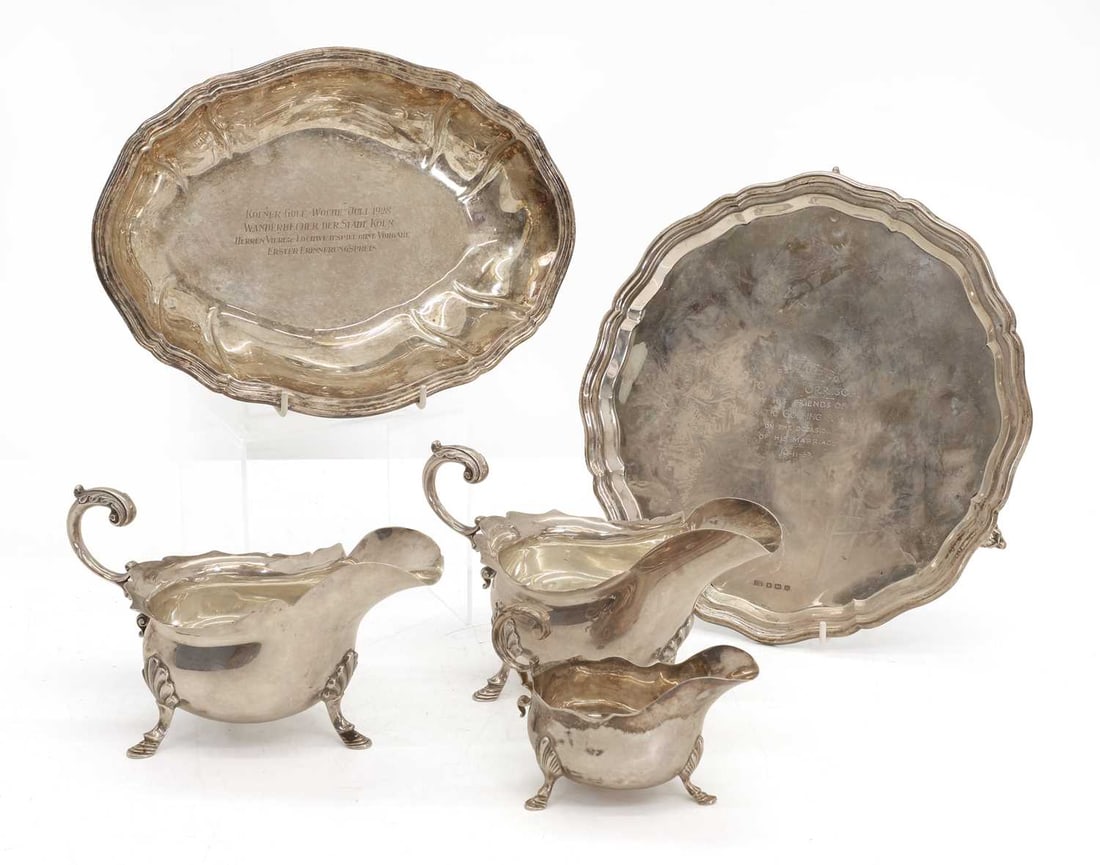 A silver salver,: A silver salver, by Viner's Ltd, Sheffield, 1963, with scalloped edge on scrolling feet, together with a matching pair of silver sauce boats by Walker & Hall, Sheffield, 1934, with scalloped rims