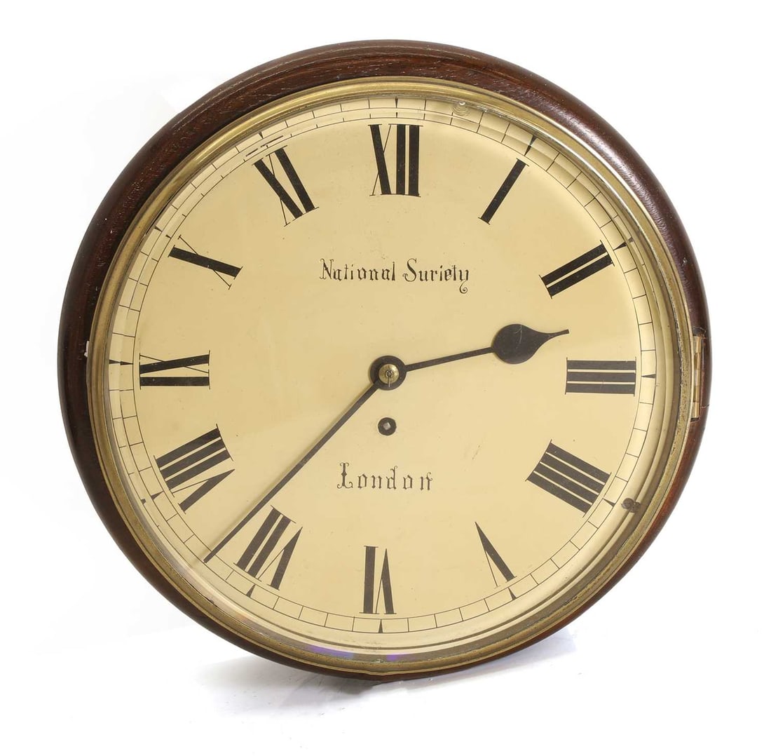 A mahogany wall clock, late 19th century / early 20th century,: A mahogany wall clock, late 19th century / early 20th century, the enamel dial with Roman numerals and titled ‘National Society’ ‘London’, with a single fusee movement,