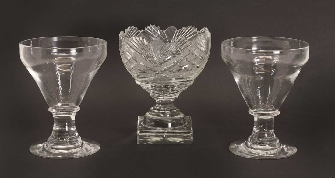 A pair of substantial glass rummers, 18th century,: A pair of substantial glass rummers, 18th century, with pan shaped bowls and a cut glass sweetmeat glass on a stepped and square base Pair 14.5cm high, single 15cm high 3 Condition Report: Good