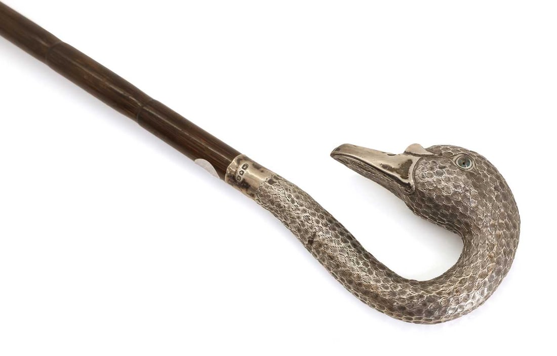 A silver-mounted swan head walking cane, makers mark CHD, London, 1902, - 2