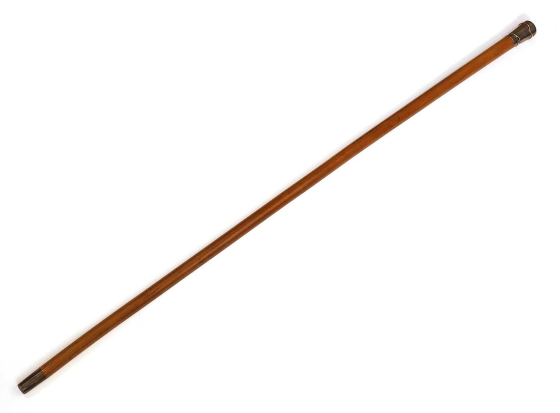 A silver-mounted walking cane makers mark C.C., London, 1910, stamped Brigg London,: A silver-mounted walking cane makers mark C.C., London, 1910, stamped Brigg London, engraved 'ARH' at the end of the pommel, with a Malacca shaft with a horn ferrule 96cm long Condition Report: Fair